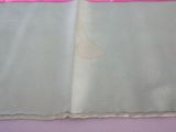 a folded piece of cloth with a sail on it