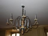 a chandelier hanging from the ceiling in a room