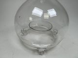 a clear glass vase with a clear base on a table