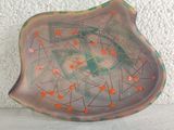 a small plate with a design on it on a table