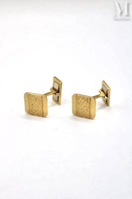 pair of gold plated cufflinks with a square design