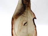 a brown and white vase with a face on it