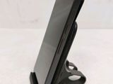 a cell phone that is sitting on top of a stand