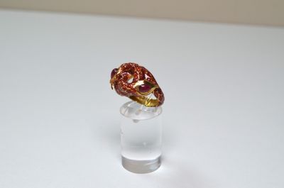 a glass cup with a chocolate candy in it on a table
