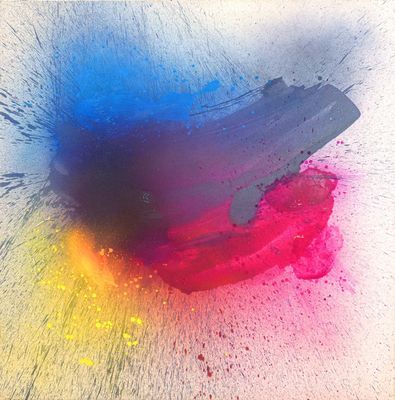 a close up of a piece of paper with paint splatters on it