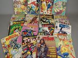 a bunch of comic books sitting on top of a table