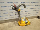 a yellow machine that is sitting on the floor