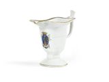 an image of a white vase with a gold rim and a coat of arms on it