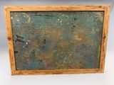 an old picture frame with rusted paint on it on a white surface