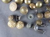 a lot of buttons that are sitting on a table