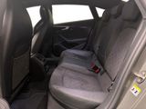 the back seats of a car with a seat belt in the back of it