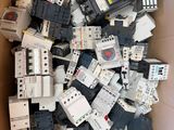 a box full of old and new circuit breakers in a cardboard box