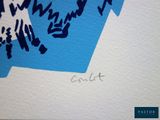a drawing of a blue bird on a piece of paper