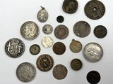a lot of coins that are on the table