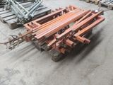 several pieces of wood are stacked on pallets in a warehouse