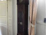 a grandfather clock in the corner of a room