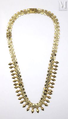 a gold necklace on a white background