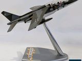 a model of a fighter jet sitting on a stand