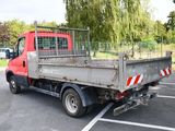 a red truck that is parked in a parking lot
