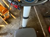 a machine that is sitting on the floor in the garage
