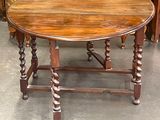 a wooden table with a wooden top and a wooden base