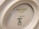 a close up of a plate with a picture of a bird on it