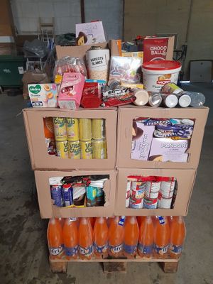 a cart full of food and drinks in a garage