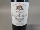 a bottle of wine that is sitting on a table