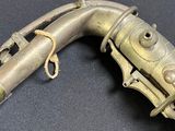 a very old gun that is laying on a table