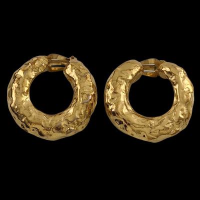 a pair of gold hoop earrings