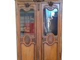 an image of a wooden cabinet with a mirror on top of it
