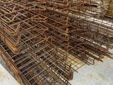 a large pile of steel bars stacked on top of each other