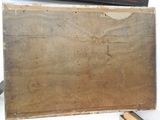 a picture of a piece of wood on a table with a pair of scissors