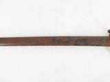 a picture of a very old looking knife on a white surface