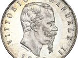 une pièce d'argent sur laquelle figurent le visage et la moustache d'un homme