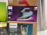 several boxes of different types of appliances are stacked on top of each other