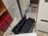 a microwave sitting on the floor next to a microwave oven