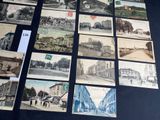 many old postcards that are on display on the table