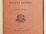 an open book with a picture of a coat of arms on it