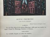 an open book with a picture of a town in the background