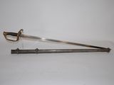 an old sword with a wooden handle on a white surface