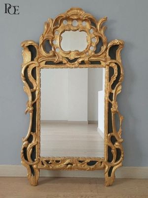 a mirror that is sitting on the floor in a room