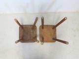 two wooden chairs that are sitting on the floor