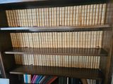 a book shelf that has many books on it