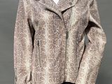 an image of a mannequin mannequin wearing a snake skin jacket