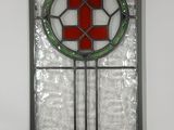 a picture of a stained glass window with a cross on it