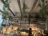 many bottles of wine on the shelves in the bar