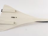 a model of a space shuttle on display on a white surface