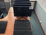 a desk with a keyboard, mouse, and monitor on it
