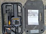 a black case that has a radio and other items in it